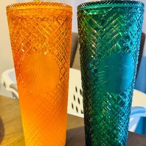 Starbucks tumbler, both brand new in an emerald and orange color.